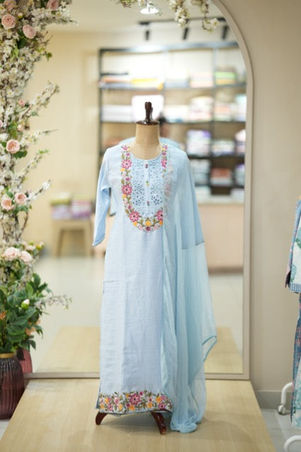 Pastel Blue Cotton Suit Set with Colorful Floral Embroidery & Lace Yoke